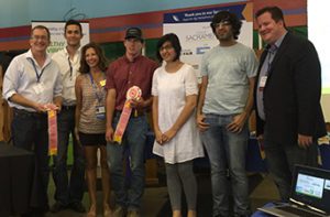 The fourth place team in the hackathon, Compostable, (from left) Regan King, Brandon Jack, with DiMare, Nathan Azevedo, Raheela Khan and Sohail Khan with Youtsey.