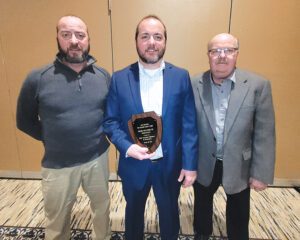 From left, Knouse Fruitlands’ Kyle, Kevin and Brian Knouse were honored for winning the best roadside market award at the Pennsylvania Farm Show. Photo by Doug Ohlemeier.