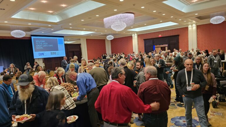 Group of people gathered in a meeting room.