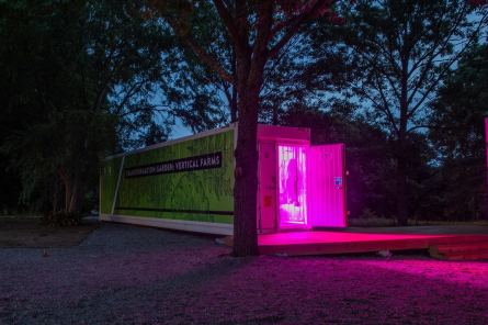 The converted, high-tech shipping containers are lit inside with red and blue LED lights, which the plants use for photosynthesis. (Auburn University)