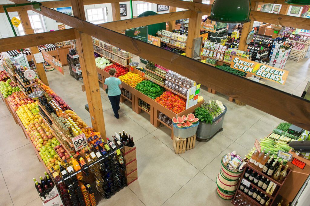 A Bedners farm store with rows of fresh produce.