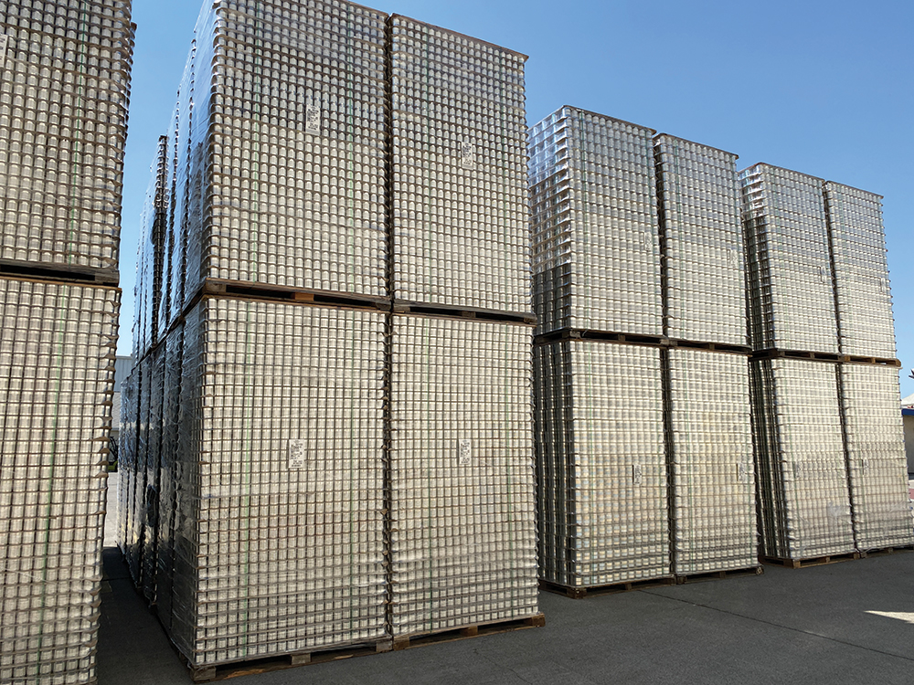 Stacks of unlabelled canned tomatoes