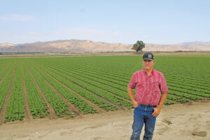 Nature’s Reward’s Mark Mason in a romaine field. Nature’s Reward employs automation and drones to help battle weeds and insects. Photos by Doug Ohlemeier.