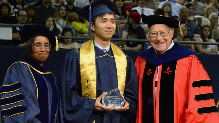Dean Dillard and Dean Emeritus Hess (in his Rutgers academic regalia) flank Chun Yin “Anson” Lai, recipient of a Charles Hess Community Service Award in 2016. 